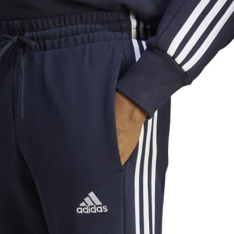 Spodnie adidas Essentials French Terry Tapered Cuff 3-Stripes M IC9406 M Spodnie adidas Essentials French Terry Tapered Cuff 3-Stripes M IC9406 M
